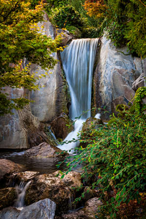 Waterfall and rocks in Japanese garden. Monte Carlo, Monaco.の写真素材