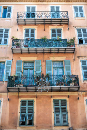 Facade of apartment building with ornate balconies in Nice, France.の写真素材