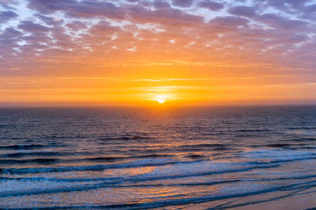 Sunrise over Atlantic ocean with dramatic sky in Florida, aerial view.の写真素材