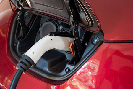 Electric car charging with level 2 charger, close up.の写真素材