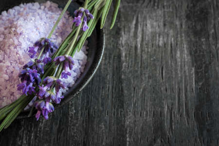 Bath salts herbal body care product with fresh lavender on rustic wooden background, copy spaceの写真素材