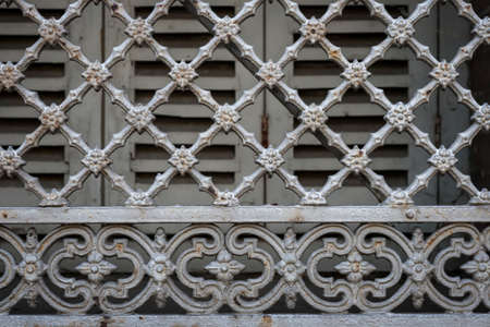 Fragment of ornamental wrought iron window grill in Toulouse, France.の写真素材