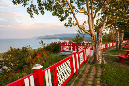 Colorful fence at lookout and picnic area at Cap-de-la-Madeleine historic site on Gaspe peninsula in Quebec, Canada.の写真素材