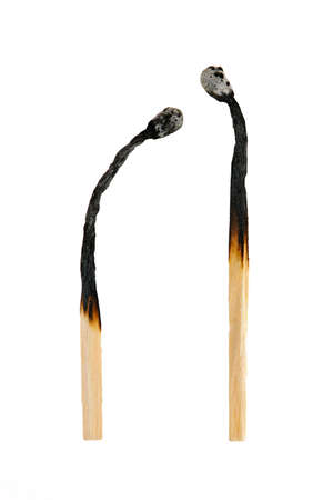 Two burned out wooden matches isolated on white backgroundの写真素材