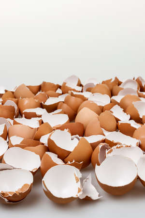 Pile of many broken brown empty eggshells