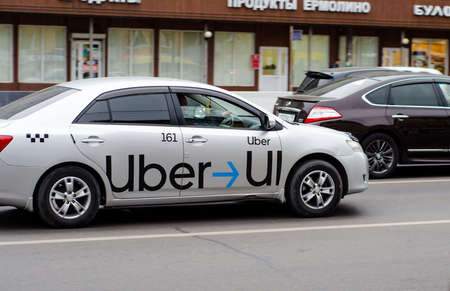 Uber taxi car in a traffic jam on a city street. Movement. Taxi call. Russia. Krasnoyarsk. 18 Sep 2020のeditorial素材