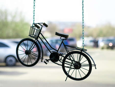 Bicycle-suspension on chain. Symbol of healthy lifestyle.