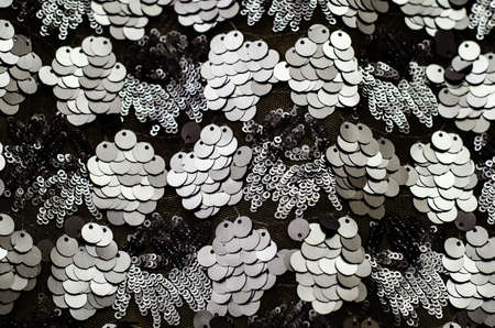 Black texture. Elegant art Deco fabric made of round black sequins.の写真素材