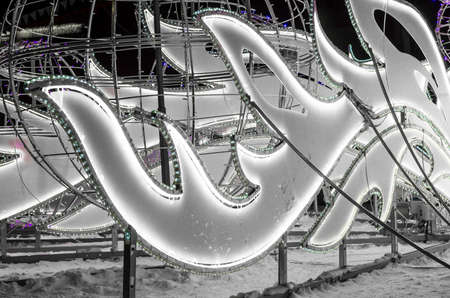Elements for lighting urban spaces. Festive new years illumination in form of white ice waves on street.の写真素材