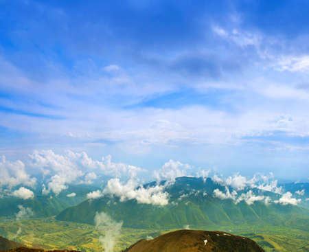 Landscape with clouds, mountains, blue sky and village. Carpathians, Ukraine. の写真素材