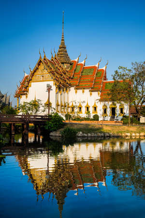 Amazing view of beautiful Dusit Maha Prasat Palace (The Grand Palace) with reflection in the water. Location: Ancient City Park, Muang Boran, Samut Prakan province,  Bangkok, Thailand. Artistic picture. Beauty world.のeditorial素材