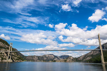 Fantastic nature landscape view of the fjord, mountains and bridge. Location: Lysefjorden, Forsand, Norway, Europe. Artistic picture. Beauty world. の写真素材