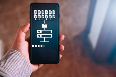 Woman hand showing data host server storage on smartphone screen. Icon for information exchange and...