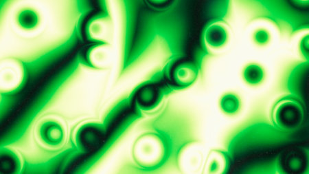Blurred green and yellow acid gradient tones. Abstract wallpaper on dark grainy background. Glowing...