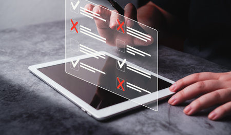 Business woman use digital tablet for online survey. Checklist with approved and rejected projects....