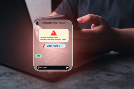Woman receives message from suspected number scam. Unwanted anonymous call. Fraud and phishing phone concept. Message from stranger.の写真素材