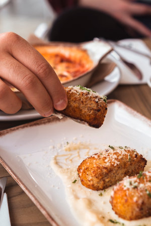 Homemade traditional Spanish croquettes or croquetas. Tapas food.