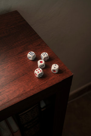 White dice on wood surface. Pile of game cubes.