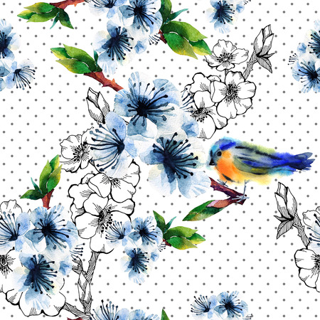 Floral seamless pattern with flowering branch and birds. Cute spring background on polka dots. For textilr, paper, wrapping and decorationの写真素材