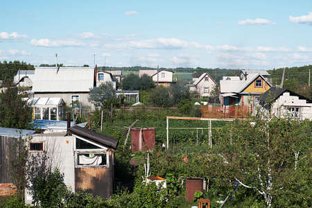 Country house. Green garden. Blue skyの写真素材