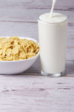 Useful healthy breakfast. Flakes with milk.の写真素材