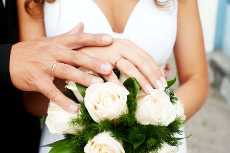 Wedding. Arms. Bouquet. Rings. Husband. Wife. Flowers.の写真素材