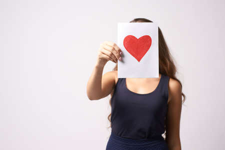 Mothers Day. Painted red heart. Adult daughter.の写真素材