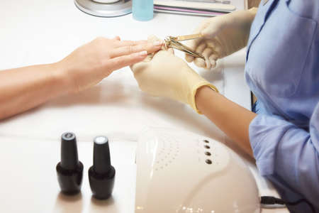 Manicure. Personal care. Master. Lacquer. Nails.の写真素材