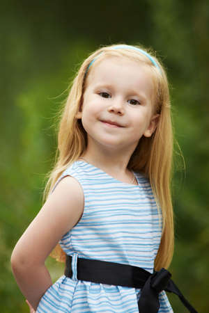 Pride. Girl. Portrait. Child. Blonde. Smile. Nature.の写真素材