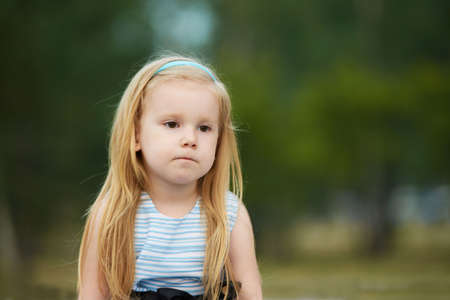 Sadness. Thoughtfulness. Little girl. Portrait child. Blonde.の写真素材