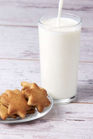 Glass milk. Gingerbread Cookie. Light background.の写真素材