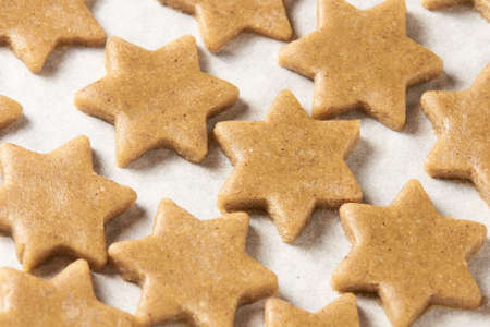 Raw dough. Ginger biscuit star. Cooking.の写真素材