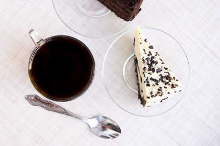 Transparent tableware. Black tea. Piece cake. の写真素材