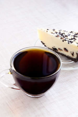 Black tea. Piece cake. Transparent tableware.の写真素材