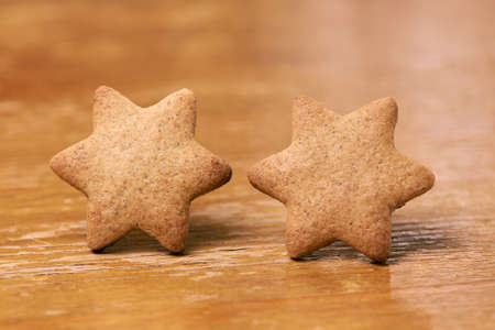 Two ginger cookies. Shape star. Blurred Background.の写真素材