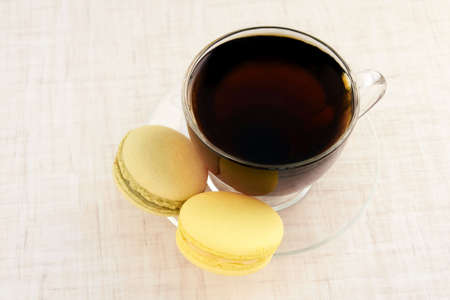 Sweet dessert. Pastry macaroons. Black tea.の写真素材