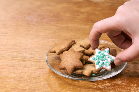 Ginger biscuit decoration. Glass plate. White glaze.の写真素材