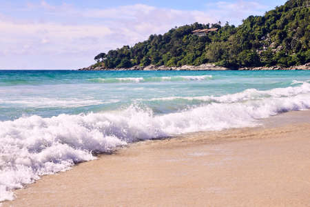 White wave. Splash. Blue sky.の写真素材