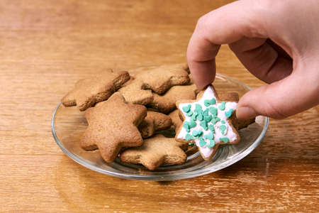 Ginger biscuit decoration. Glass plate. White glaze.の写真素材