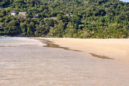 Walking along  beach. Warm sand. Green Mountain.の写真素材