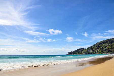 Blue sea. Clear sky. Green Mountain.の写真素材