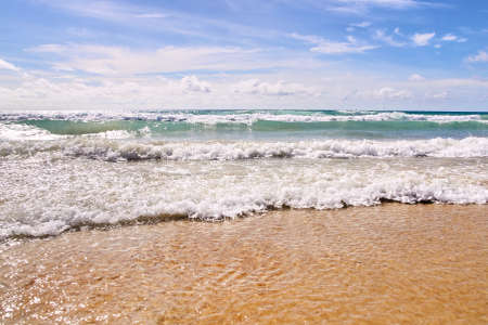 Coast. Warm blue water. Light Sand.の写真素材