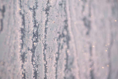 Pattern on glass. Snowflakes. White color. Brilliant texture.の写真素材