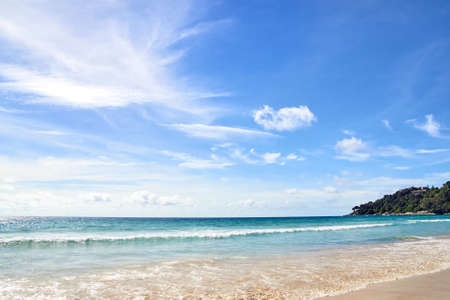 Clear sky. Blue sea. Green Mountain.の写真素材