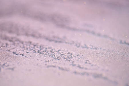 Winter background. White snowflakes. Grey colour. Glitter.の写真素材