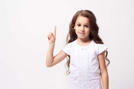 Beautiful portrait. Little girl. White background.の写真素材