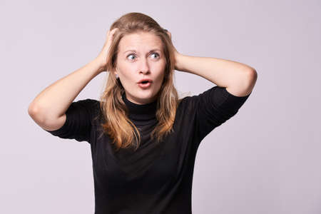 Beautiful girl. Surprise emotion. White background.の写真素材