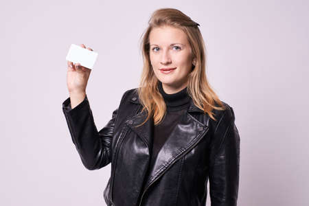 Beautiful girl. White card. Black clothes.の写真素材