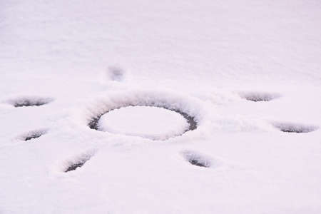 White snow. Painted sun. Horizontal.の写真素材