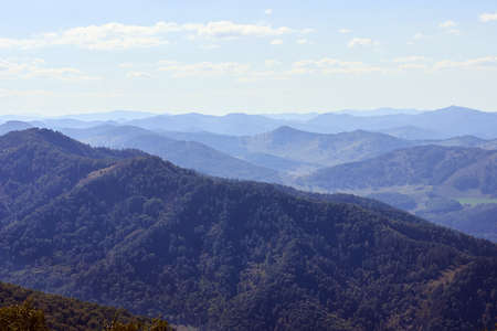 Endless expanse. High mountains. Green Forest. Blue sky.の写真素材